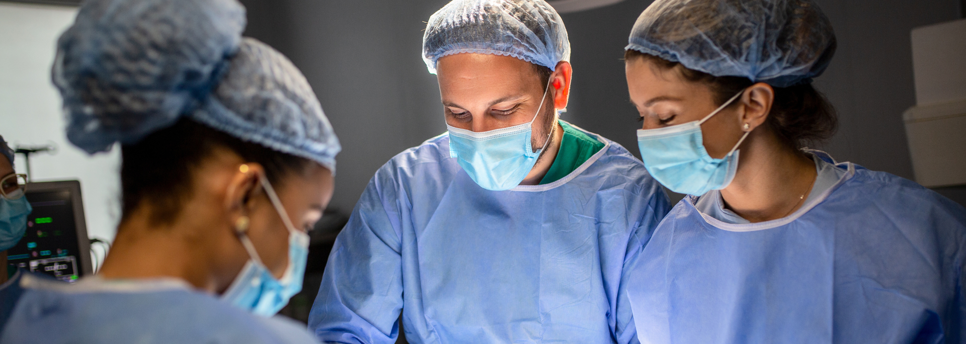 Picture of surgeons performing an operation. 