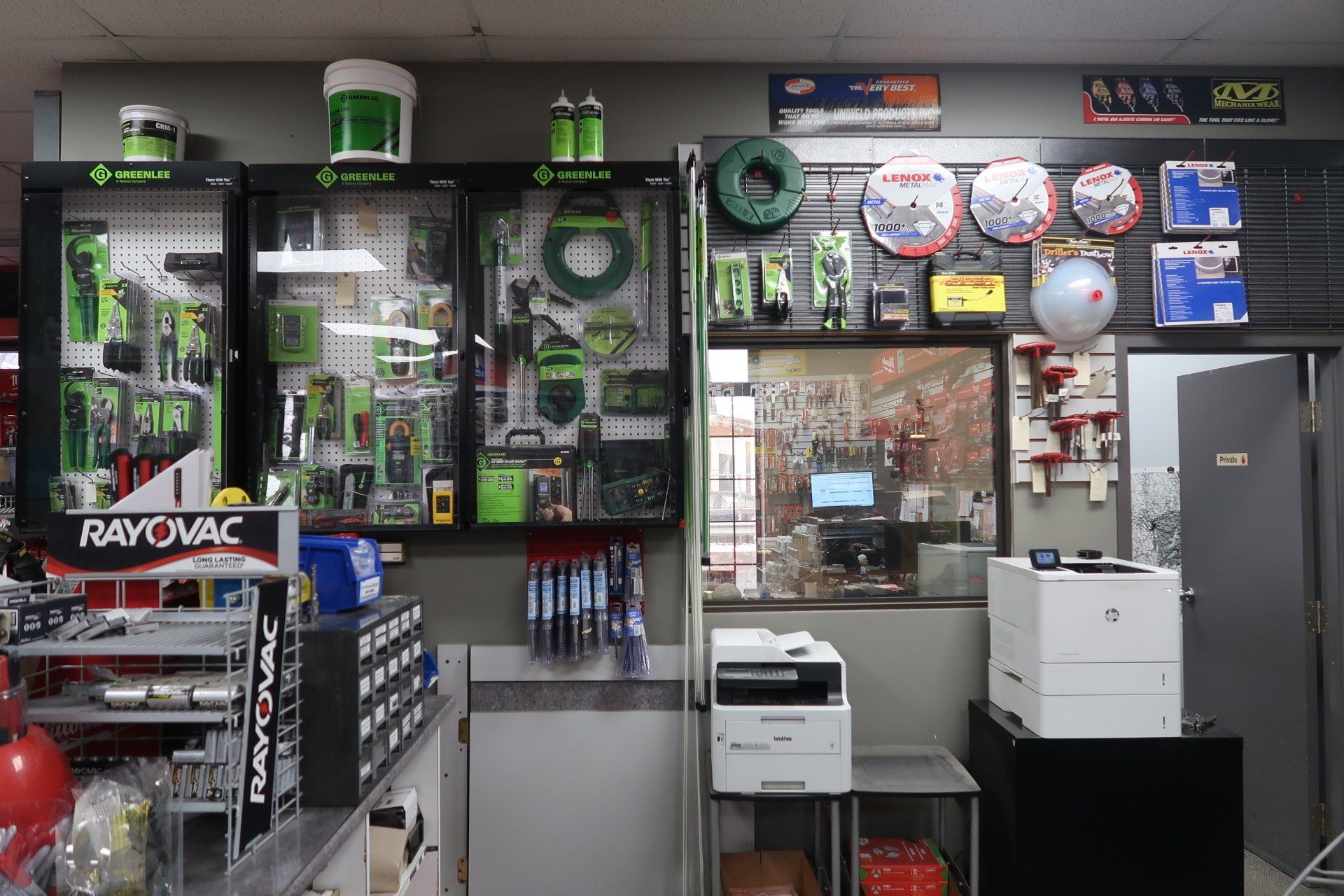 The inside of a store with a rayovac sign on the wall