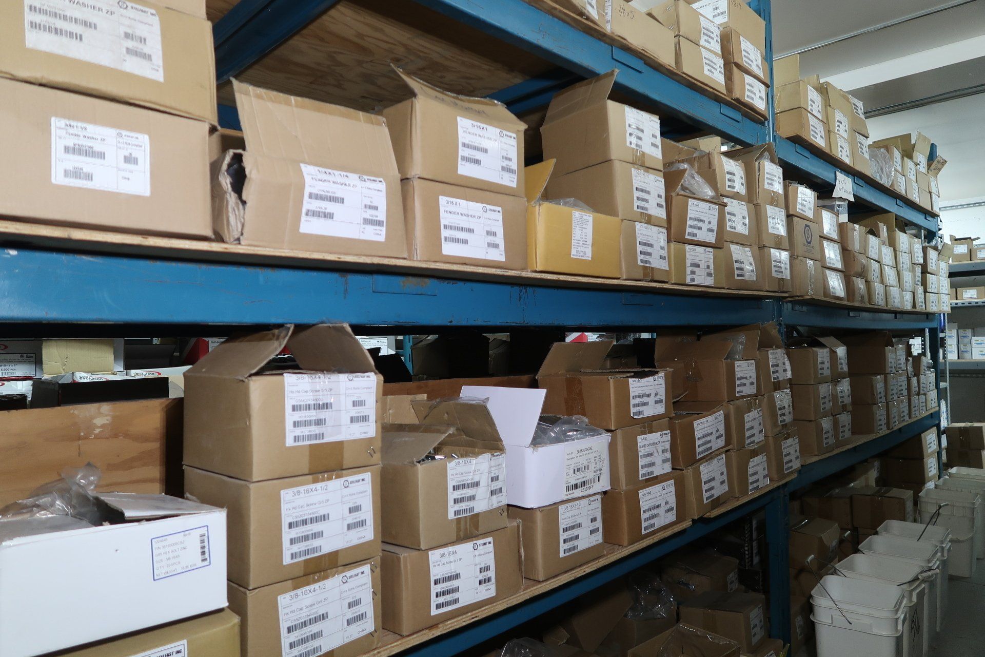 A warehouse filled with lots of cardboard boxes