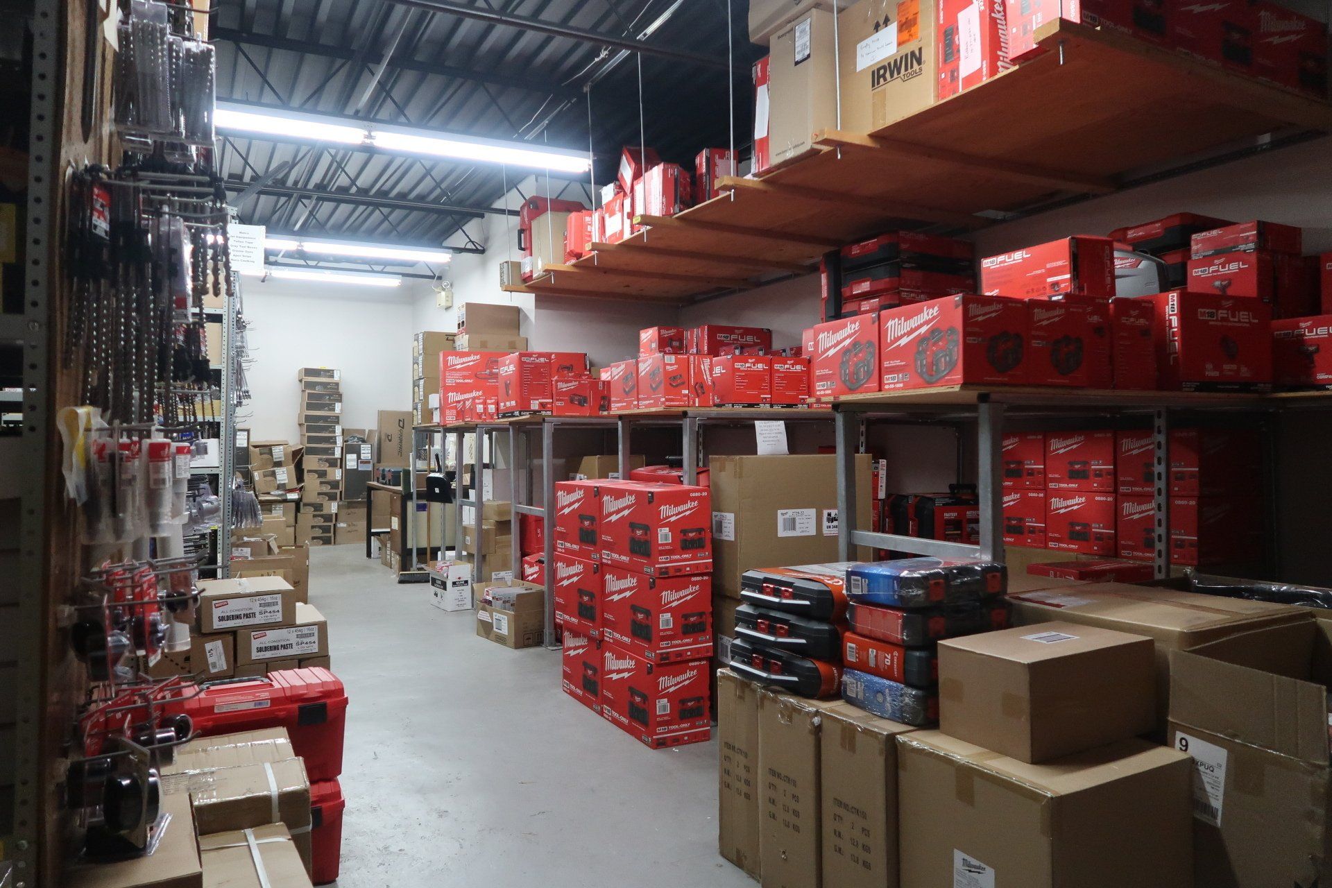 A large warehouse filled with lots of boxes and shelves.