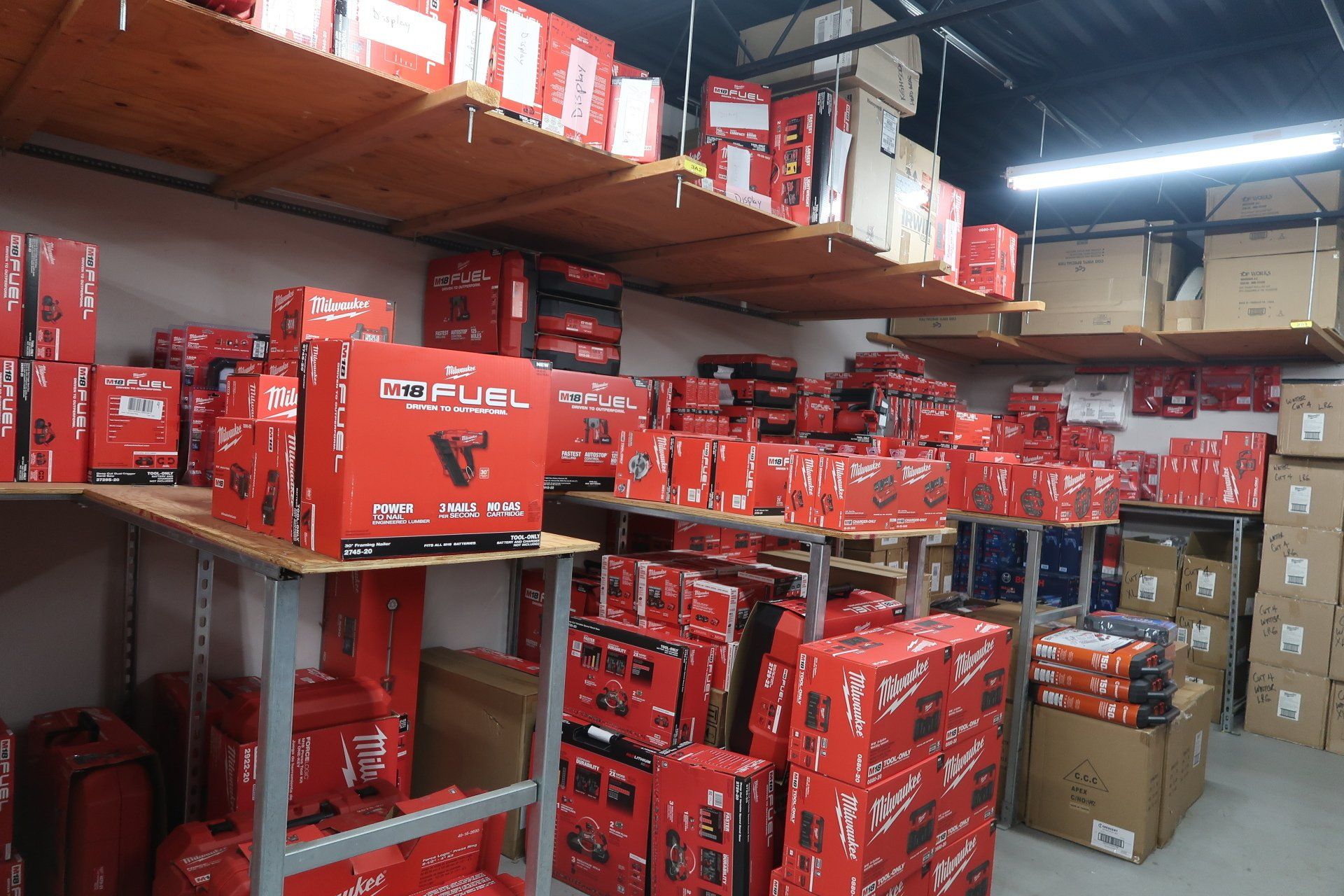 A warehouse filled with lots of red boxes and shelves