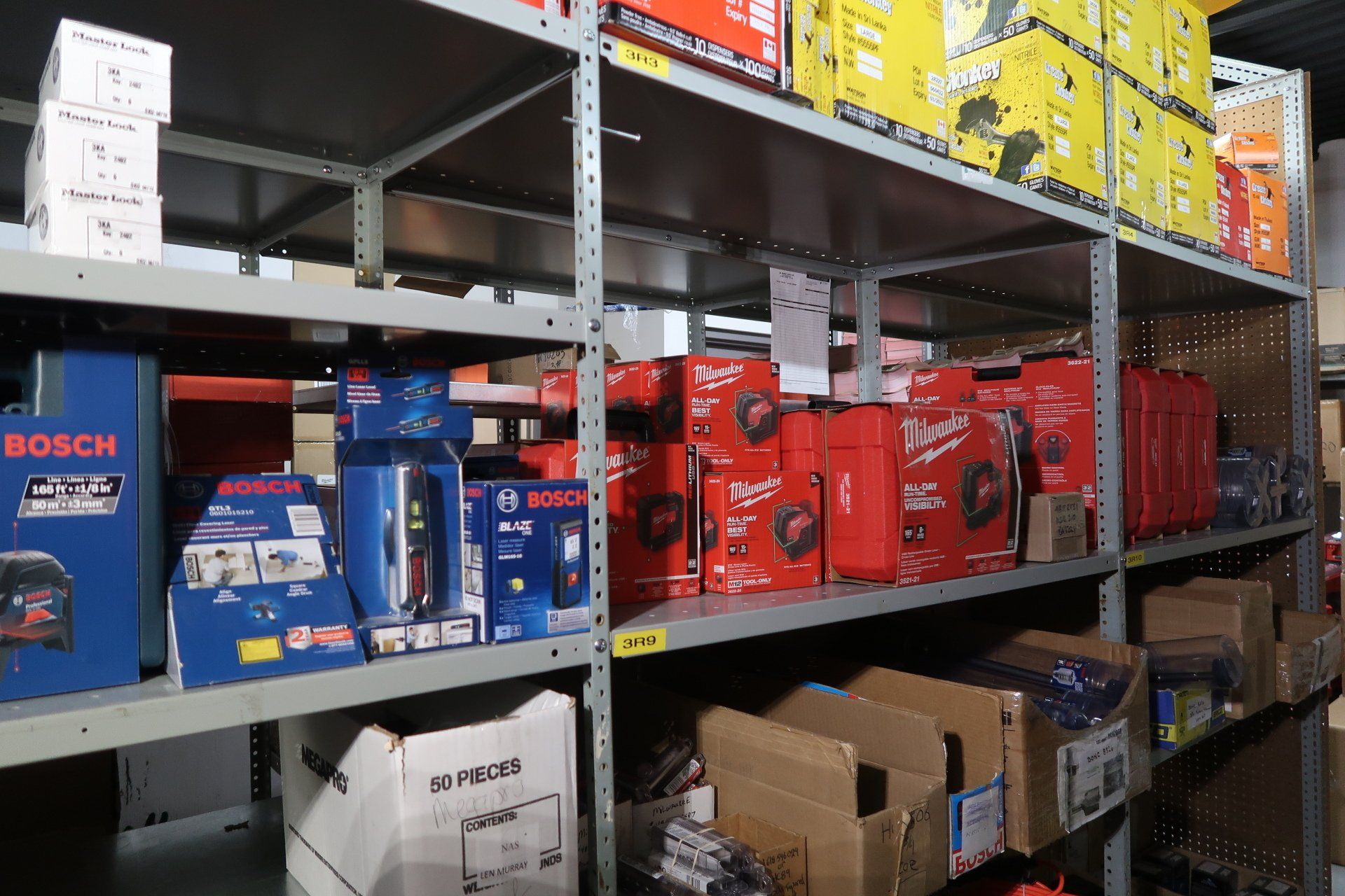 A warehouse filled with lots of boxes including one that says bosch