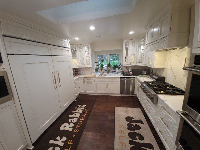 a kitchen with a rug that says jack rabbit self storage