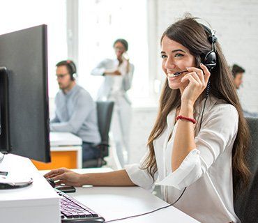 Smiling Agent Woman With Headsets — Concord, NH — New England Call Center