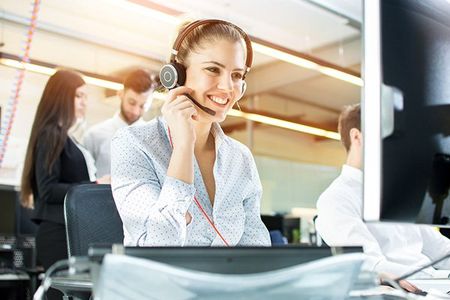 Smiling Female Customer Service Operator Working — Concord, NH — New England Call Center