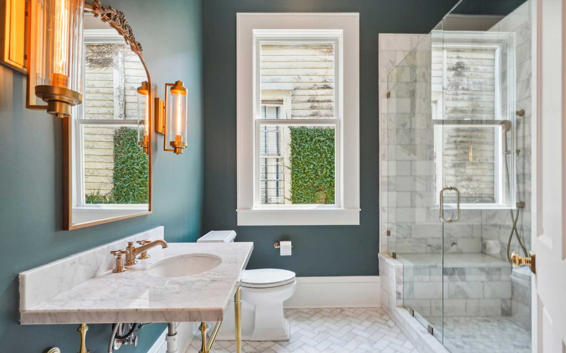 A bathroom with a sink , toilet , and shower.