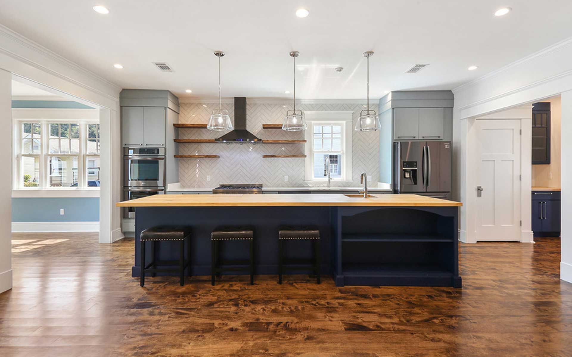 A kitchen with a large island in the middle of the room.