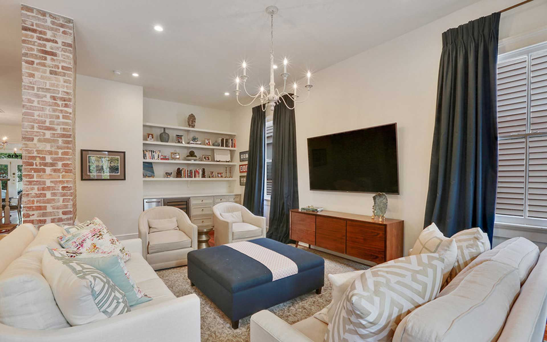 A living room filled with furniture and a flat screen tv.