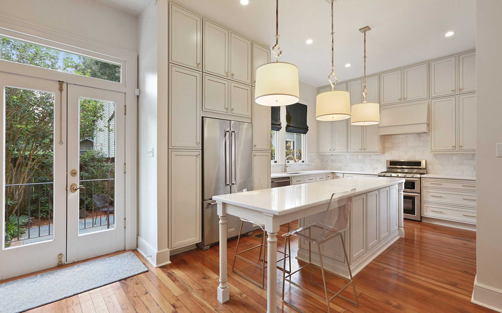 There is a large island in the middle of the kitchen.
