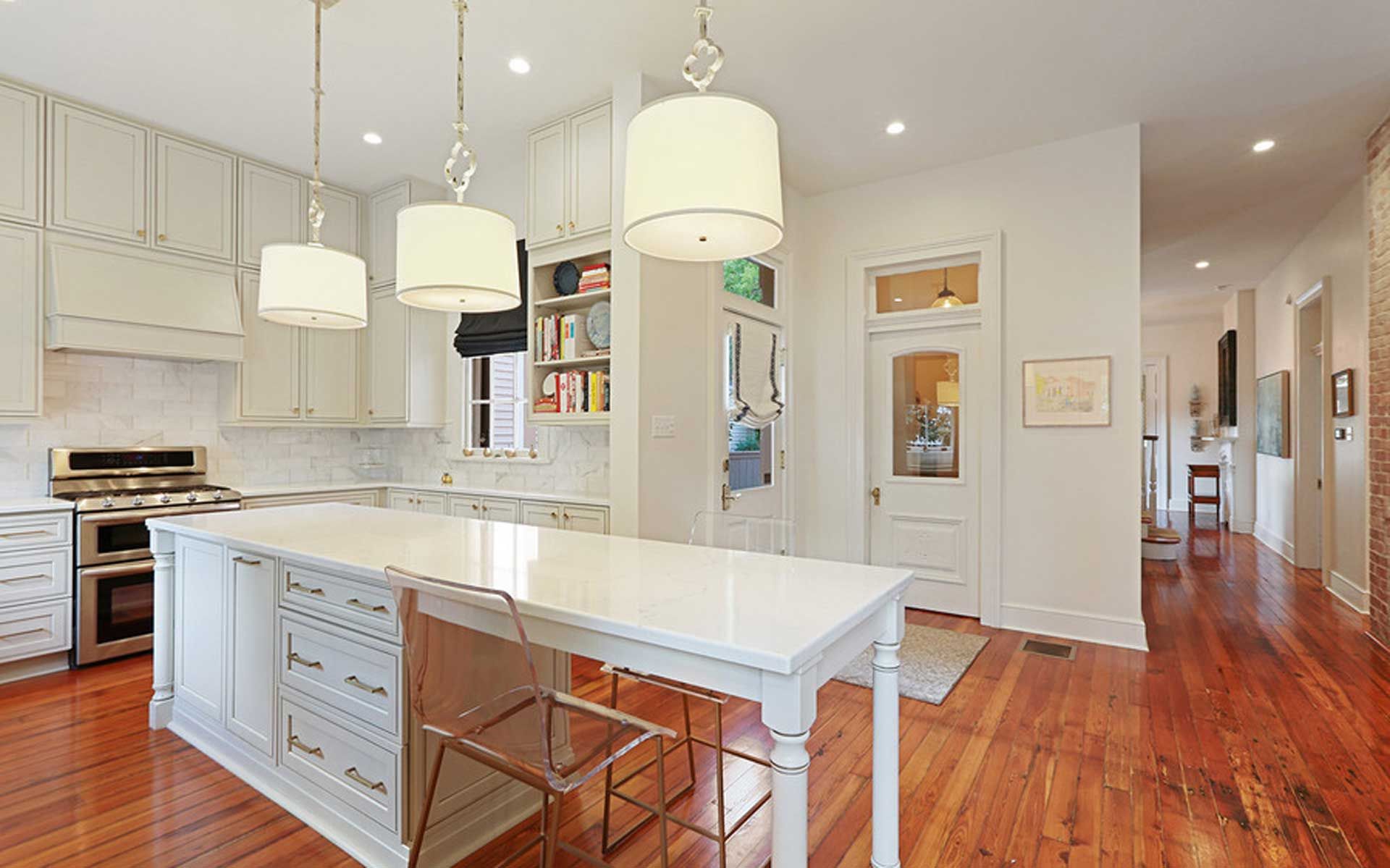 There is a large island in the middle of the kitchen.