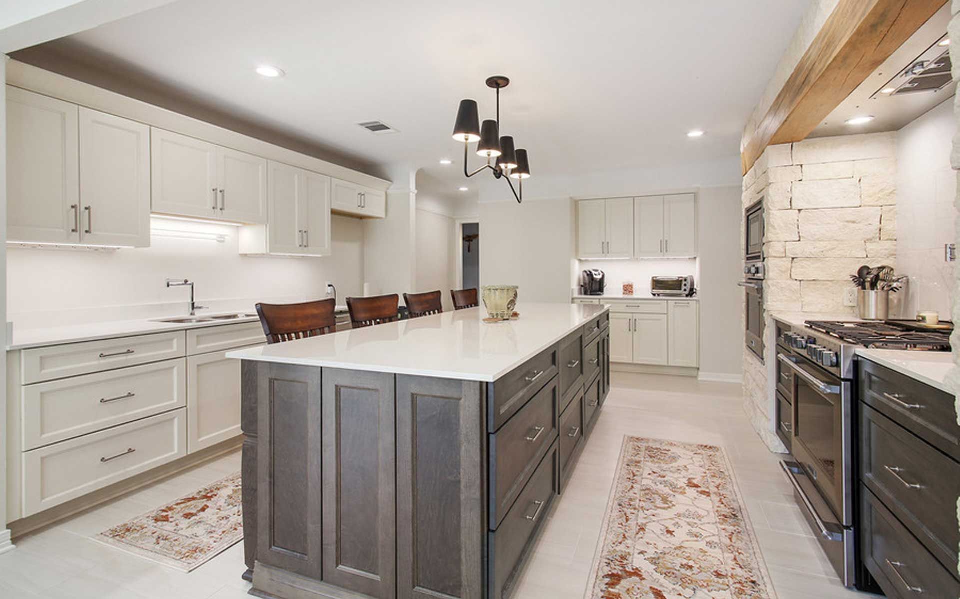 There is a large island in the middle of the kitchen.
