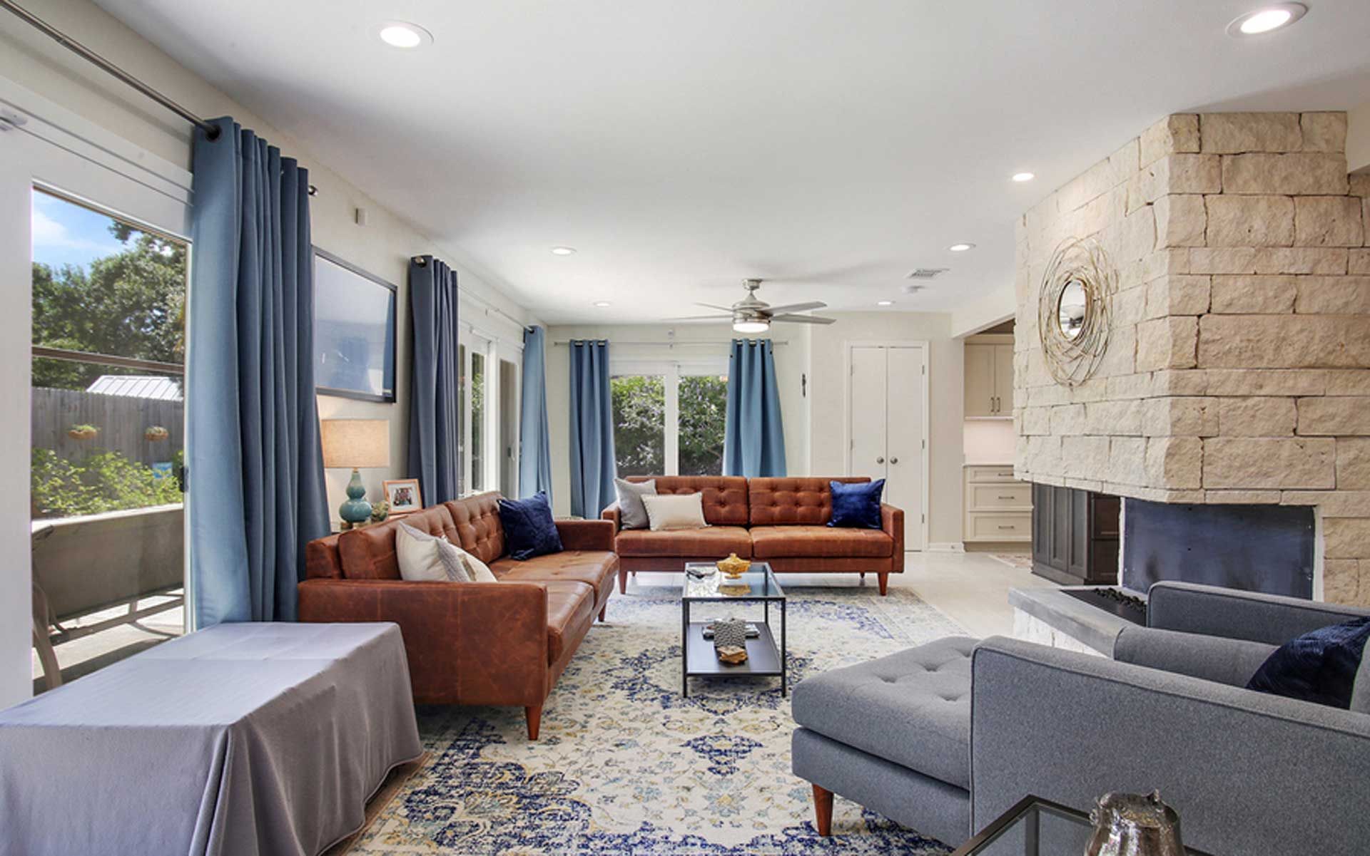 A living room filled with furniture and a fireplace.