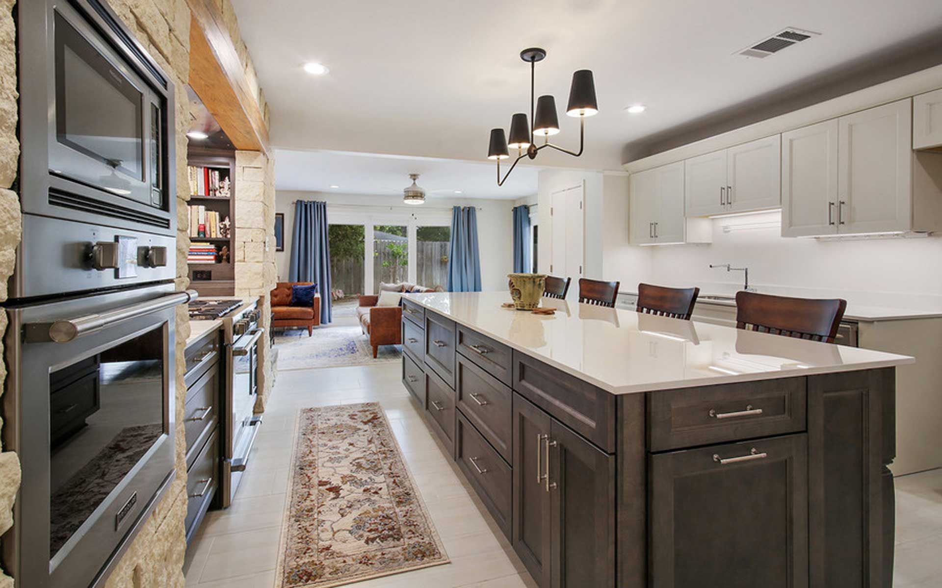 A kitchen with a large island and lots of cabinets