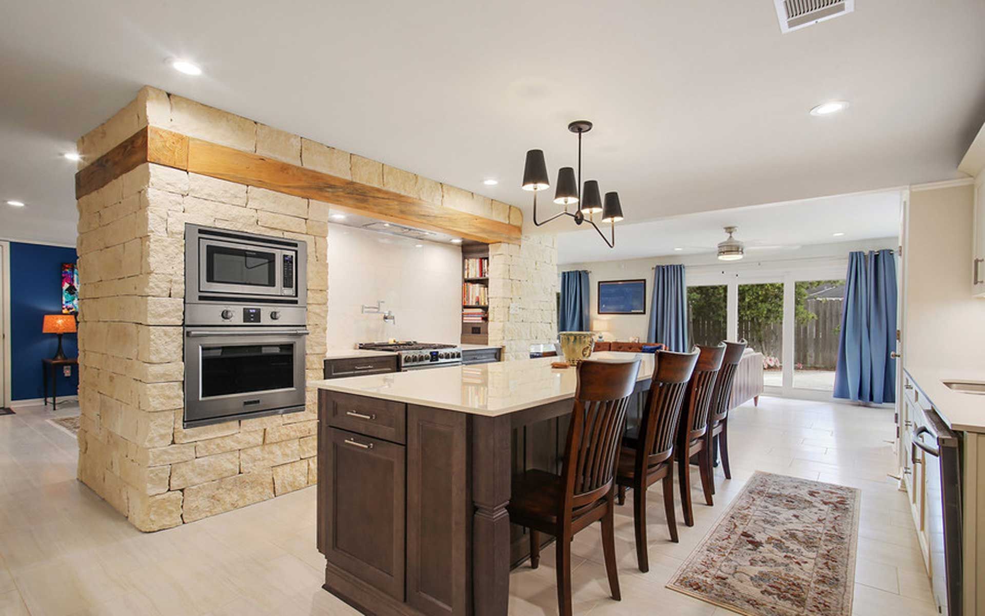 There is a large island in the middle of the kitchen.