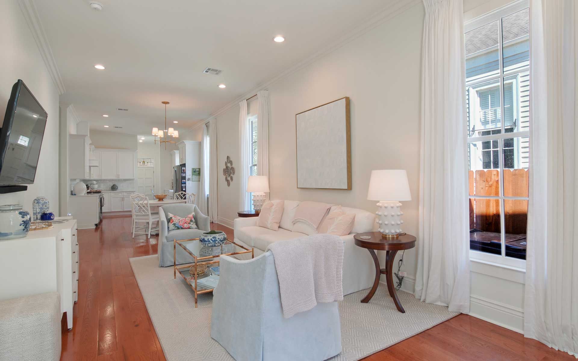A living room filled with furniture and a flat screen tv.
