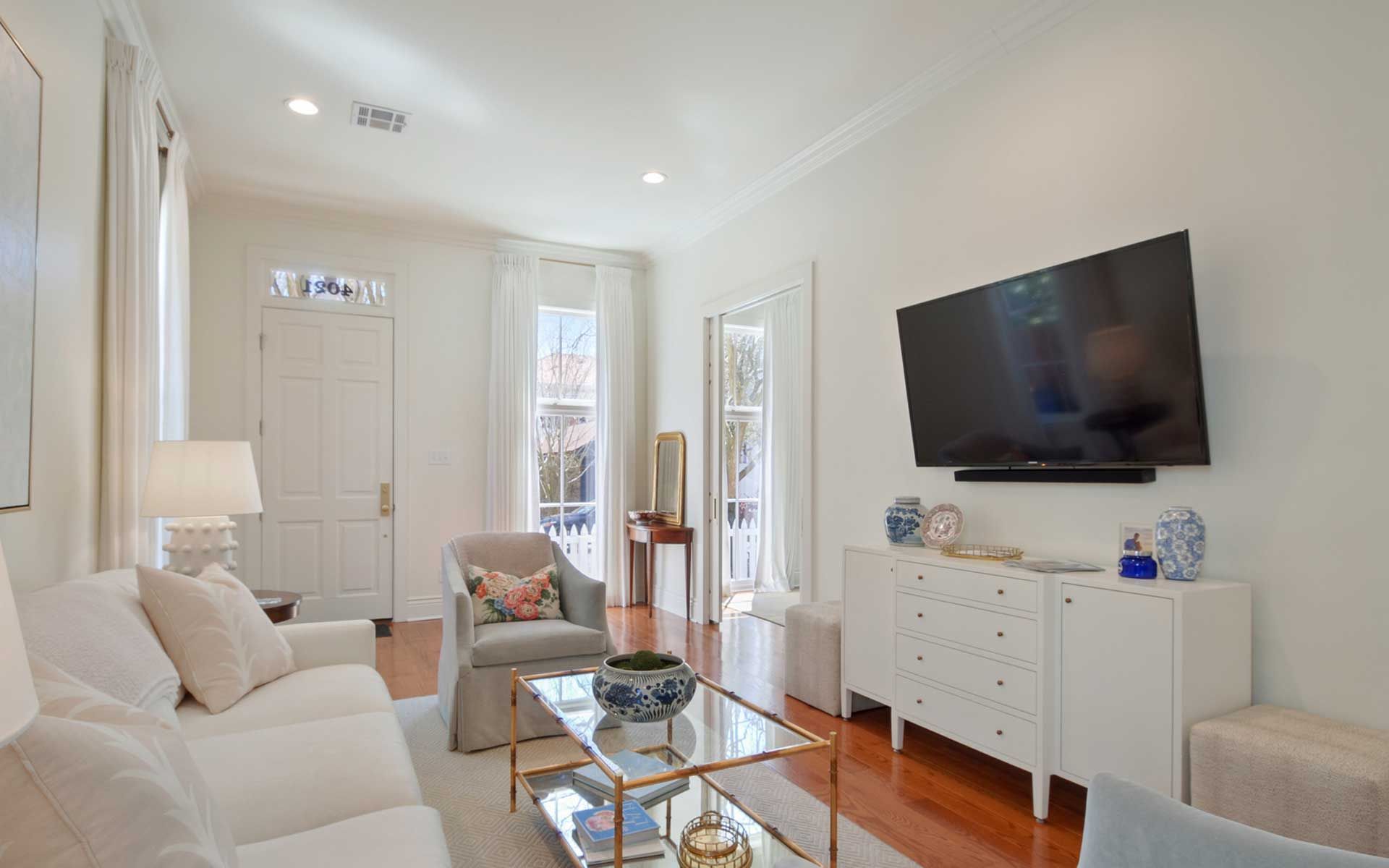 A living room filled with furniture and a flat screen tv.