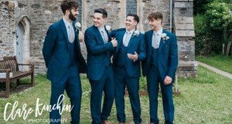 Adam and his groomsmen wear Navy suits with matching Navy scooped waistcoat