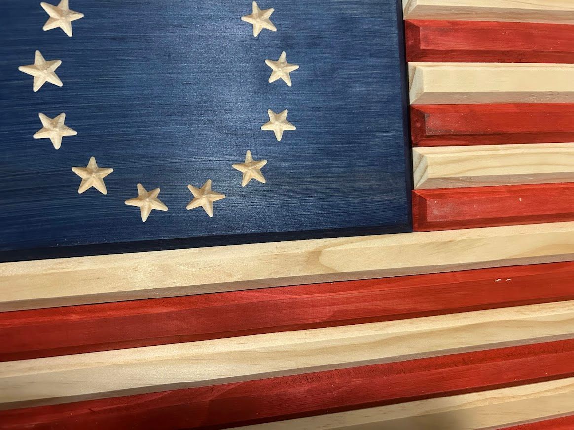 Wooden Betsy Ross flag, blue canton with white stars, red and white stripes.