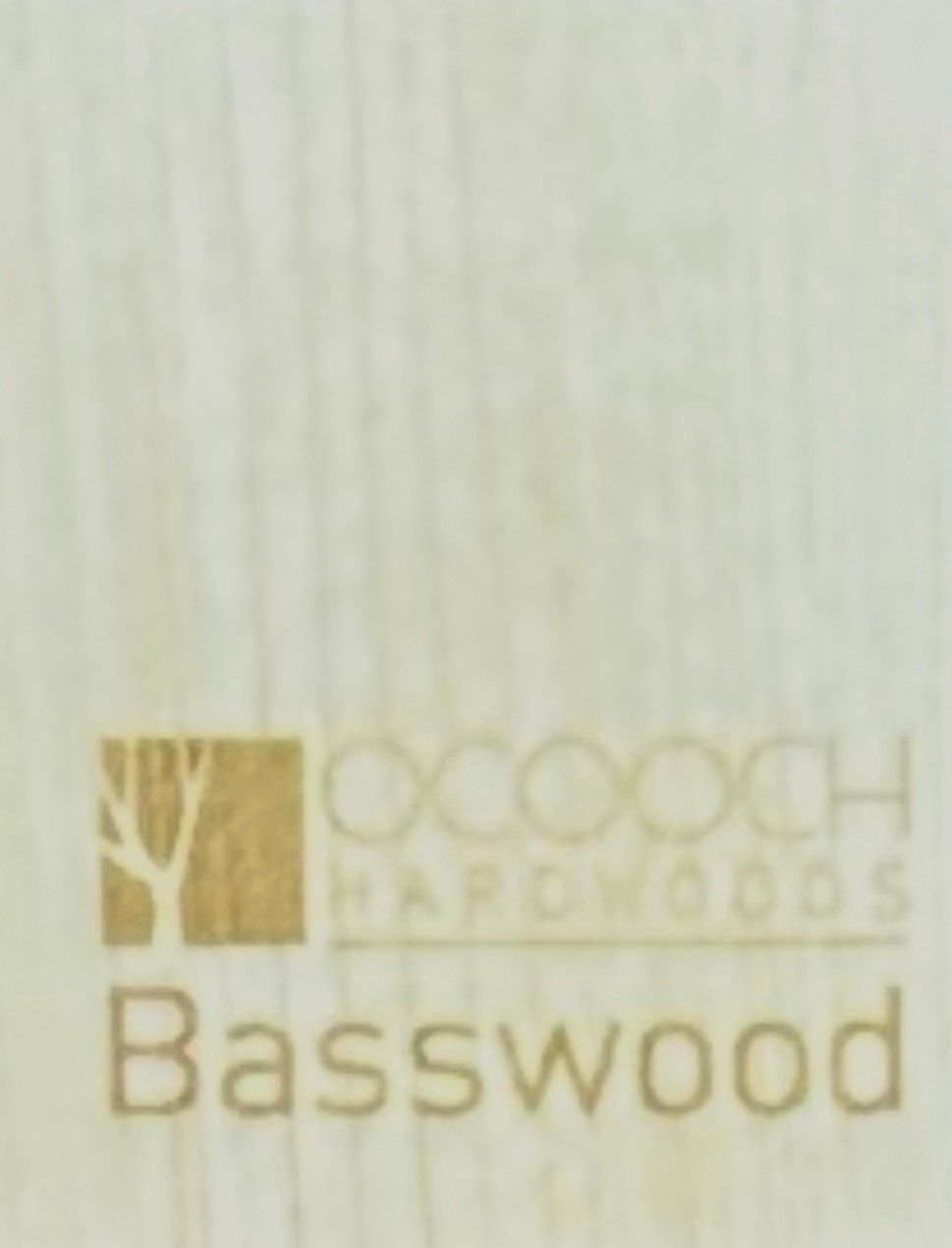 Wooden cabinet displaying various wood samples on a workbench.