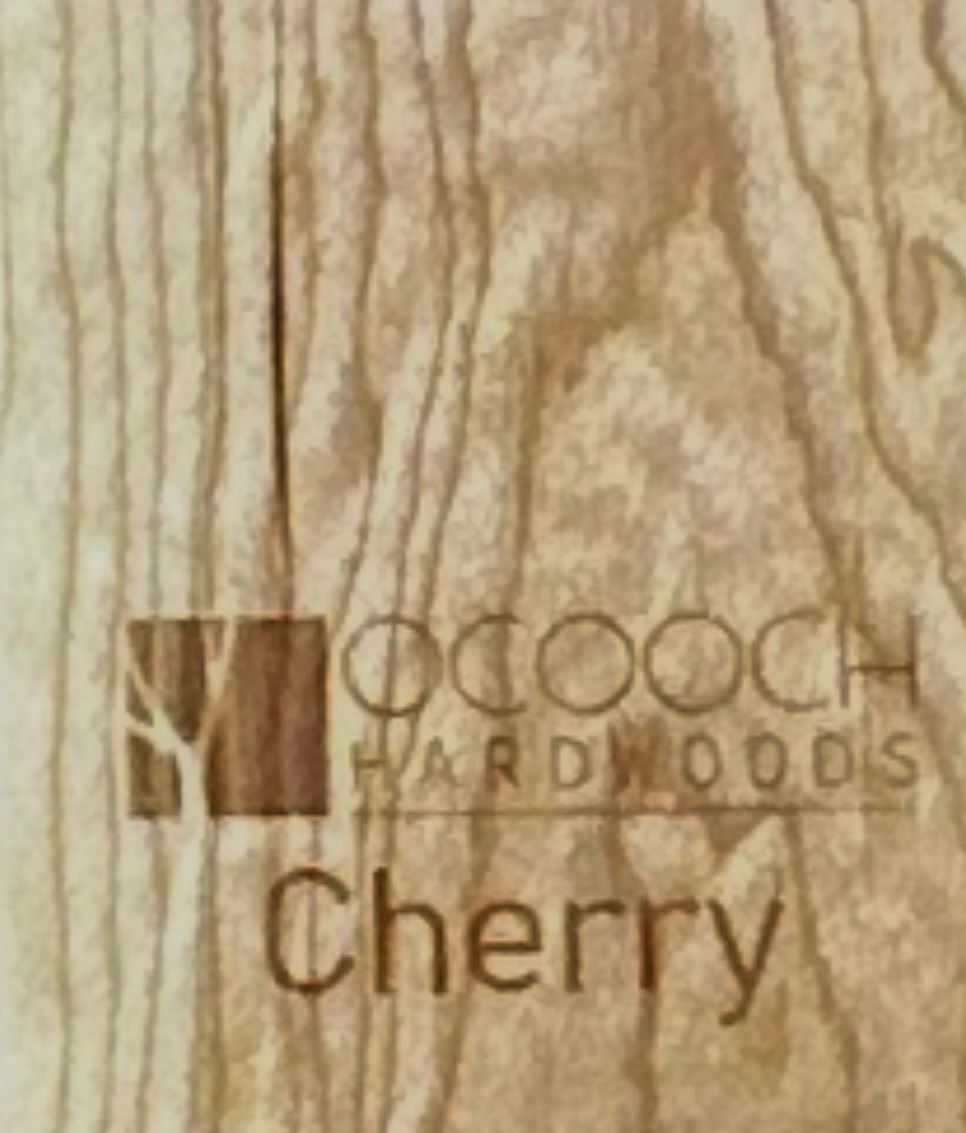 Wooden cabinet displaying various wood samples on a workbench.