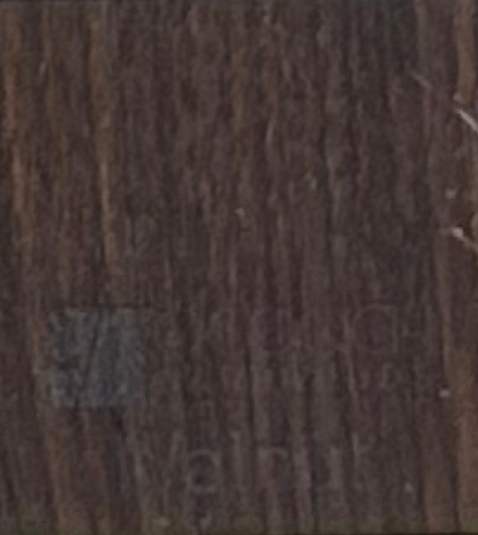 Wooden cabinet displaying wood samples on a workbench in a workshop.