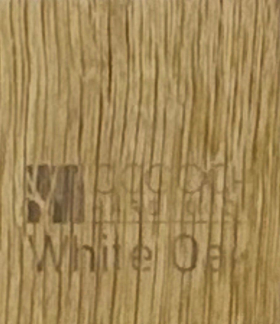 Wooden cabinet displaying wood samples on a workbench in a workshop.