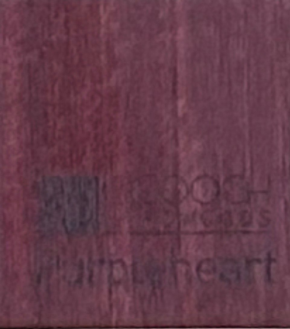 Wooden cabinet displaying wood samples on a workbench in a workshop.