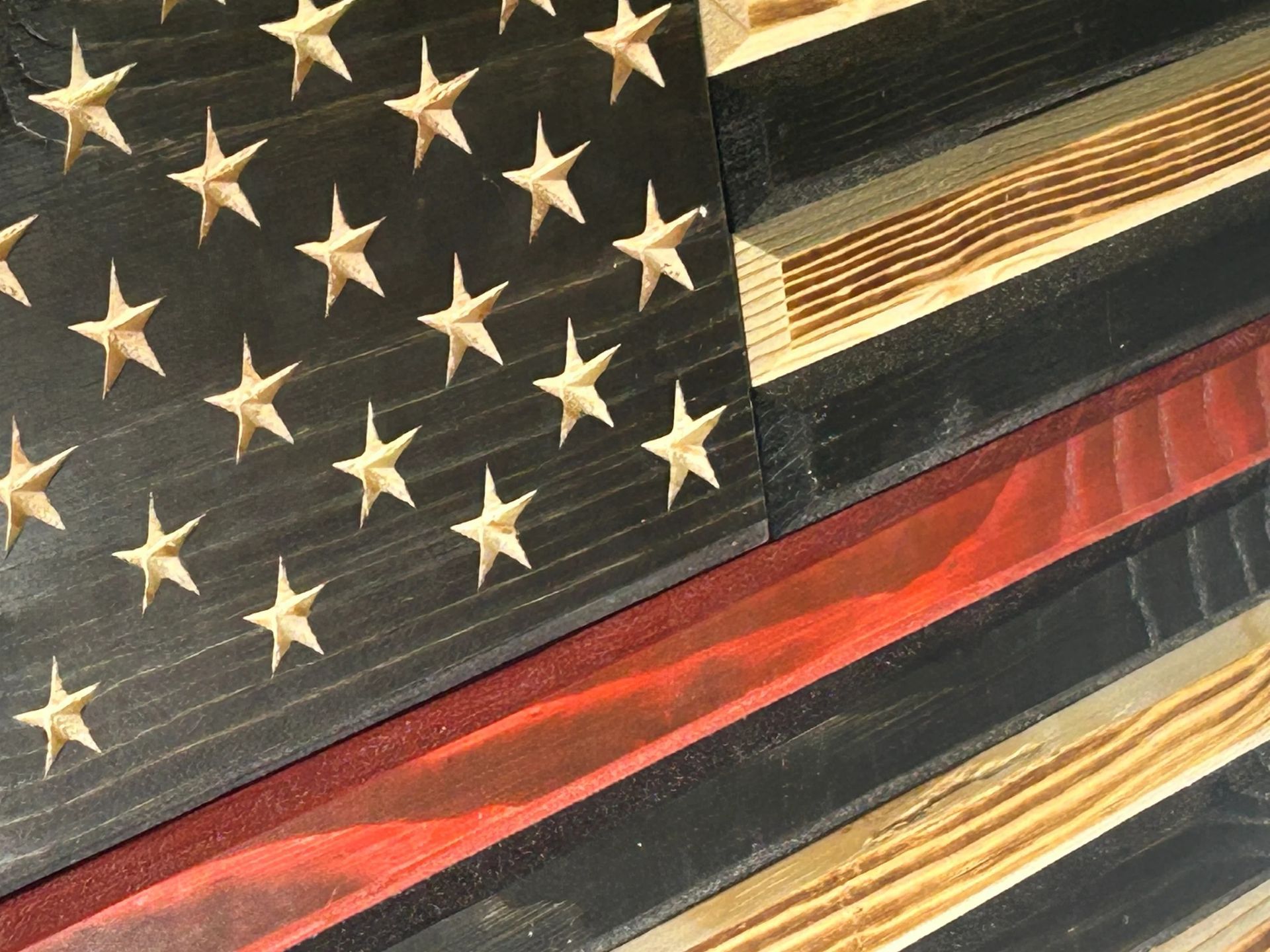 Wooden American flag with a red stripe, the “Thin Red Line” for firefighters.