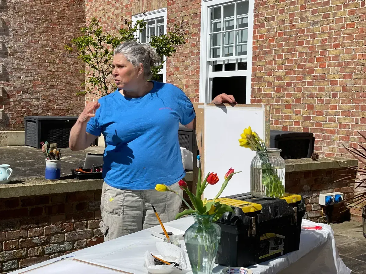 Debbie Nuttall Artist Wild & Wonderful Workshop | a woman in a blue shirt with the word columbia on it
