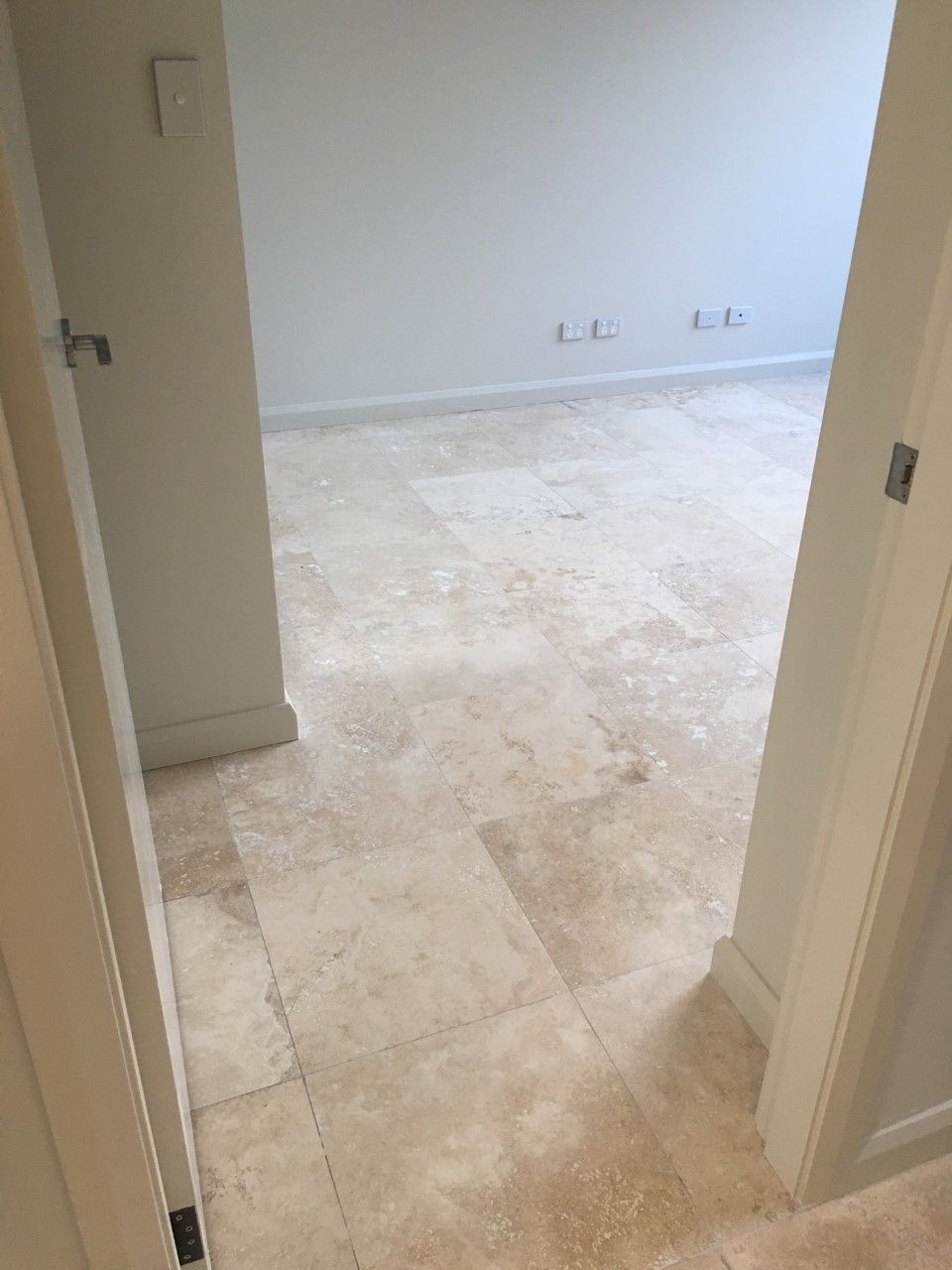 Beige Tiled Floor in a Room Viewed From a Doorway — Enviro Clean Carpet and Tile Cleaning in Woy Woy, NSW