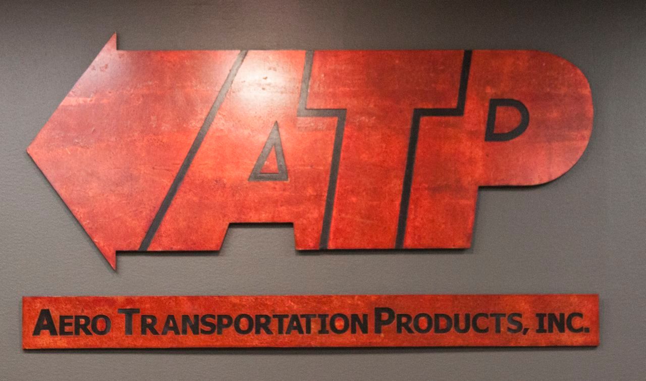 A red sign that says aero transportation products inc.