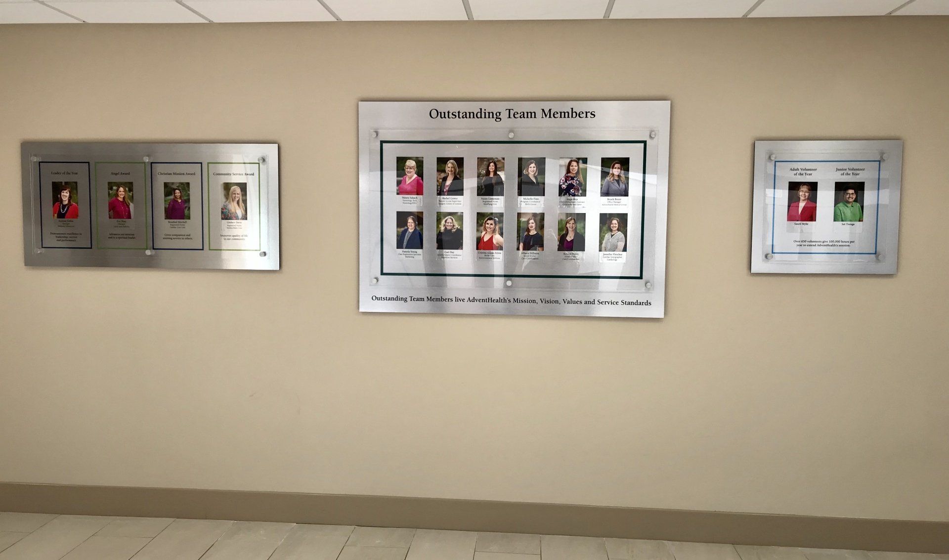 A wall with pictures on it and a sign that says community that works