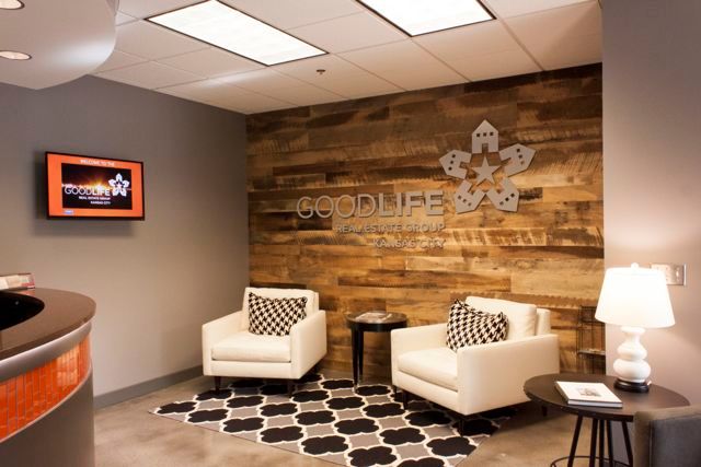 A waiting room with two chairs and a sign that says goodlife