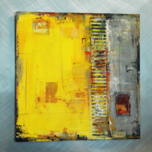A yellow and gray painting on a blue surface