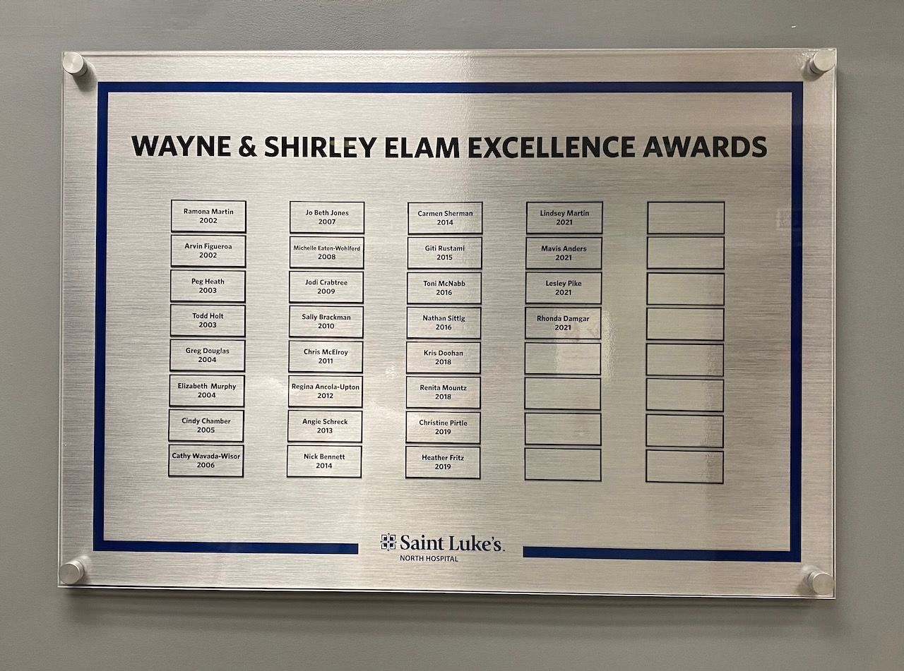 A sign that says wayne & shirley elam excellence awards