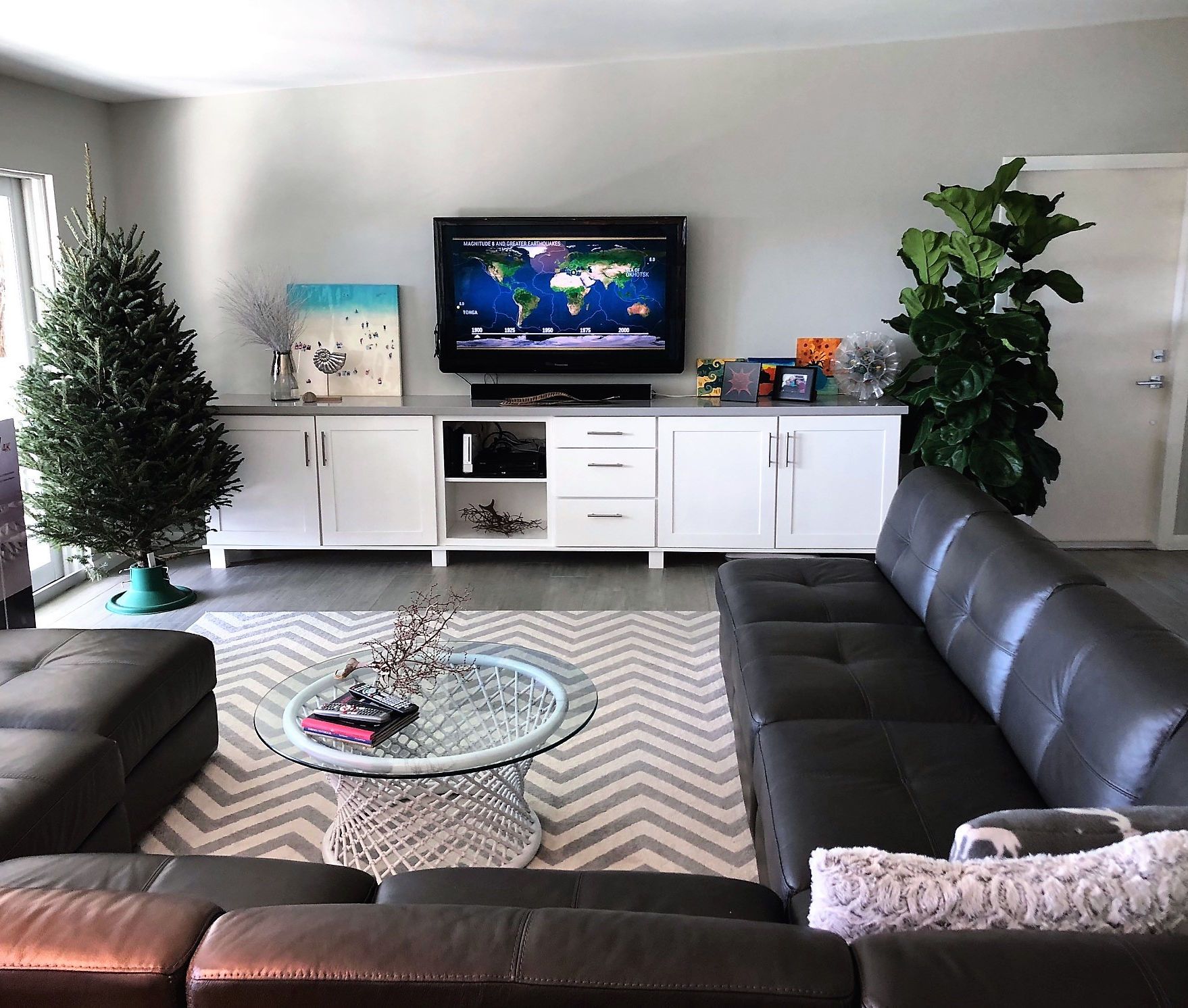 A living room with a couch and a flat screen tv