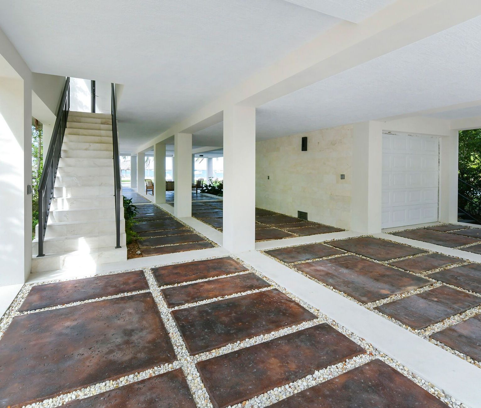 A large building with a staircase leading up to the second floor