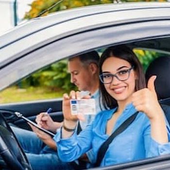 woman smiling with drivers licence