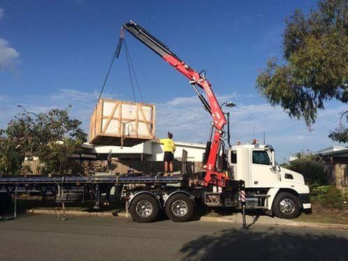 Crane lifting — Truck services in Warana, QLD