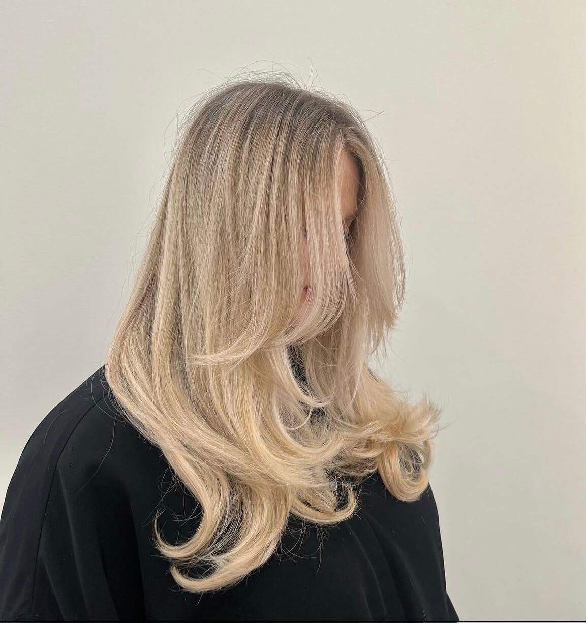 woman with recently cut wavy blonde hair