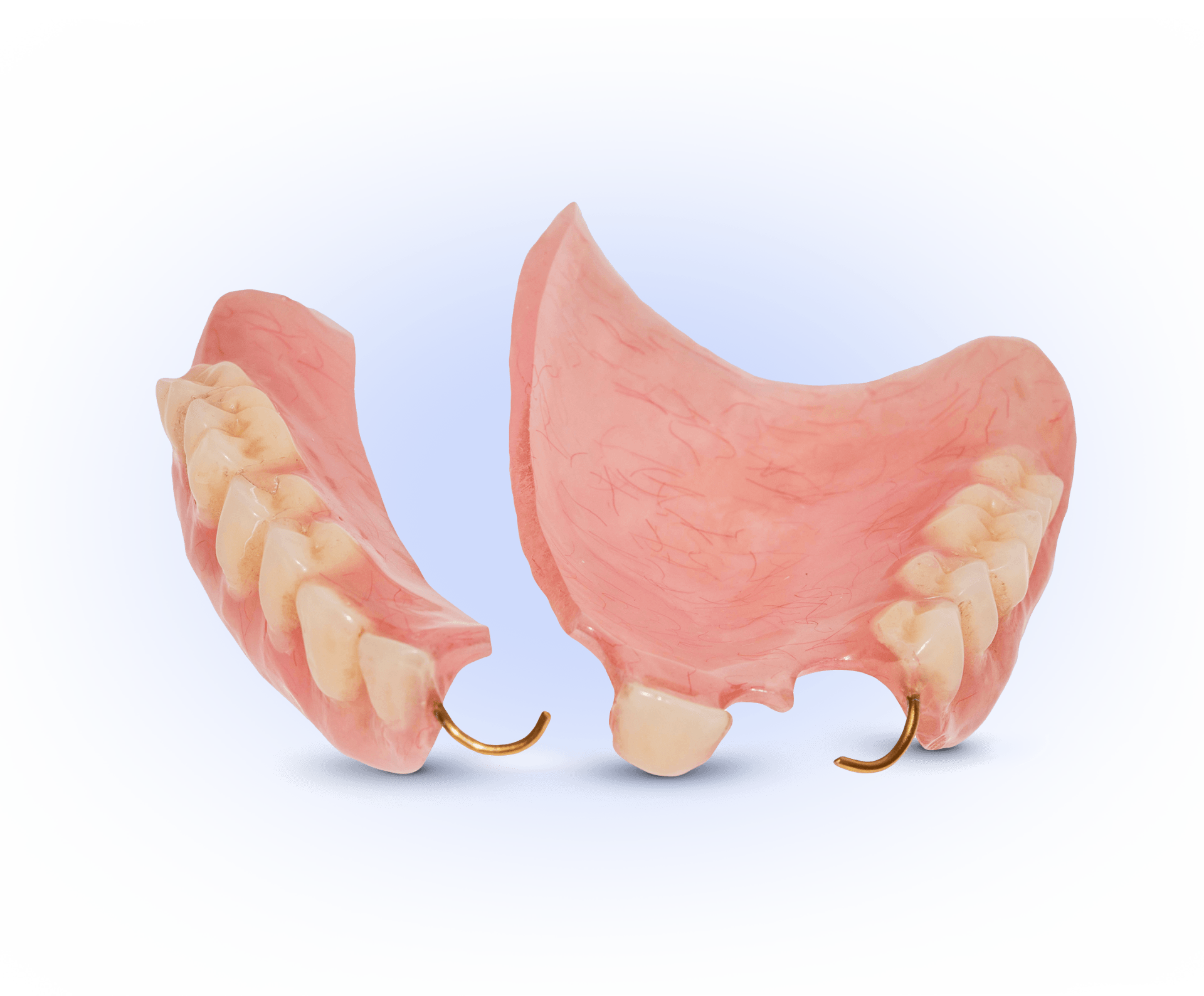 A close up of a denture on a white background