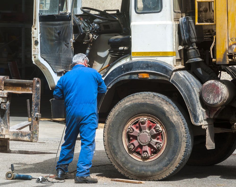 Worker Mechanical Repairing Truck — Mobile Truck Repairs in Singleton, NSW