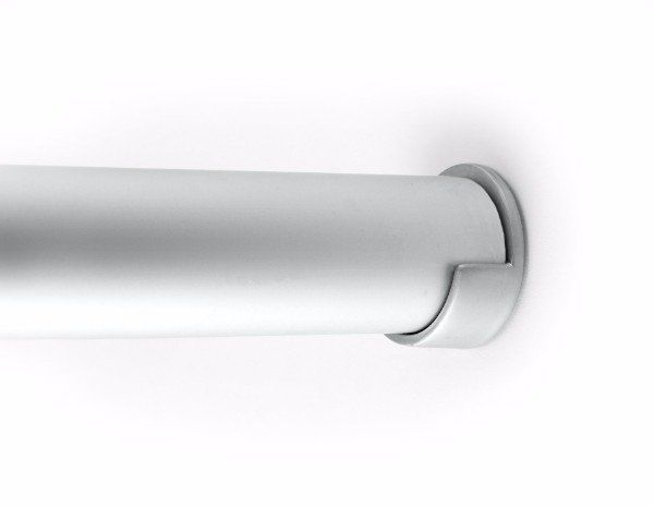a close up of a stainless steel railing on a white wall .
