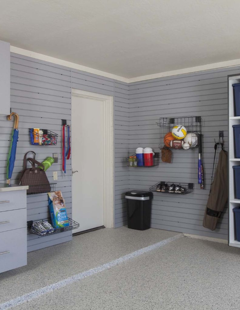 a stainless steel workbench with a drawer full of tools