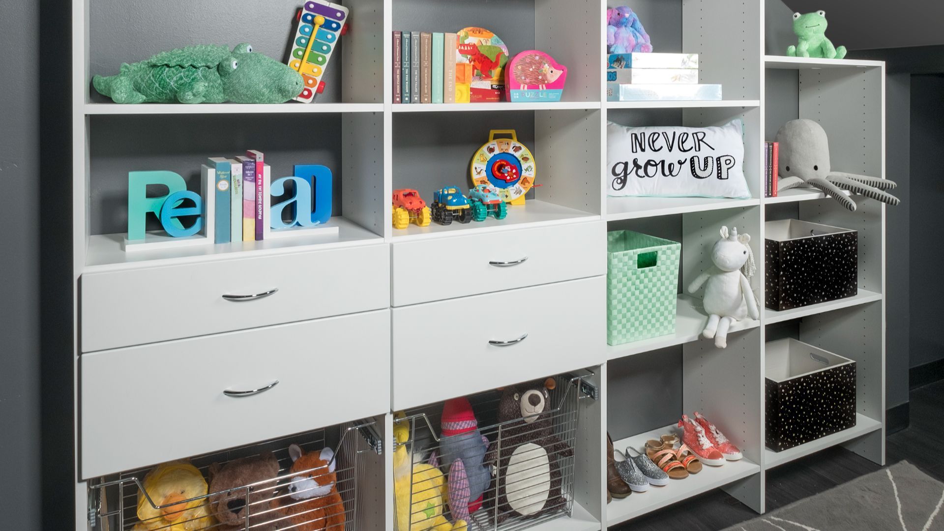 a mudroom with a snowboard hanging on the wall and a coat hanging on the wall .