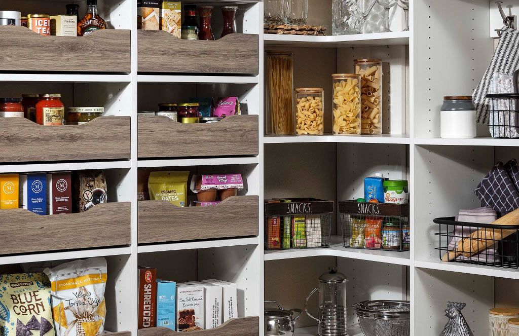 a pantry filled with lots of food and utensils .