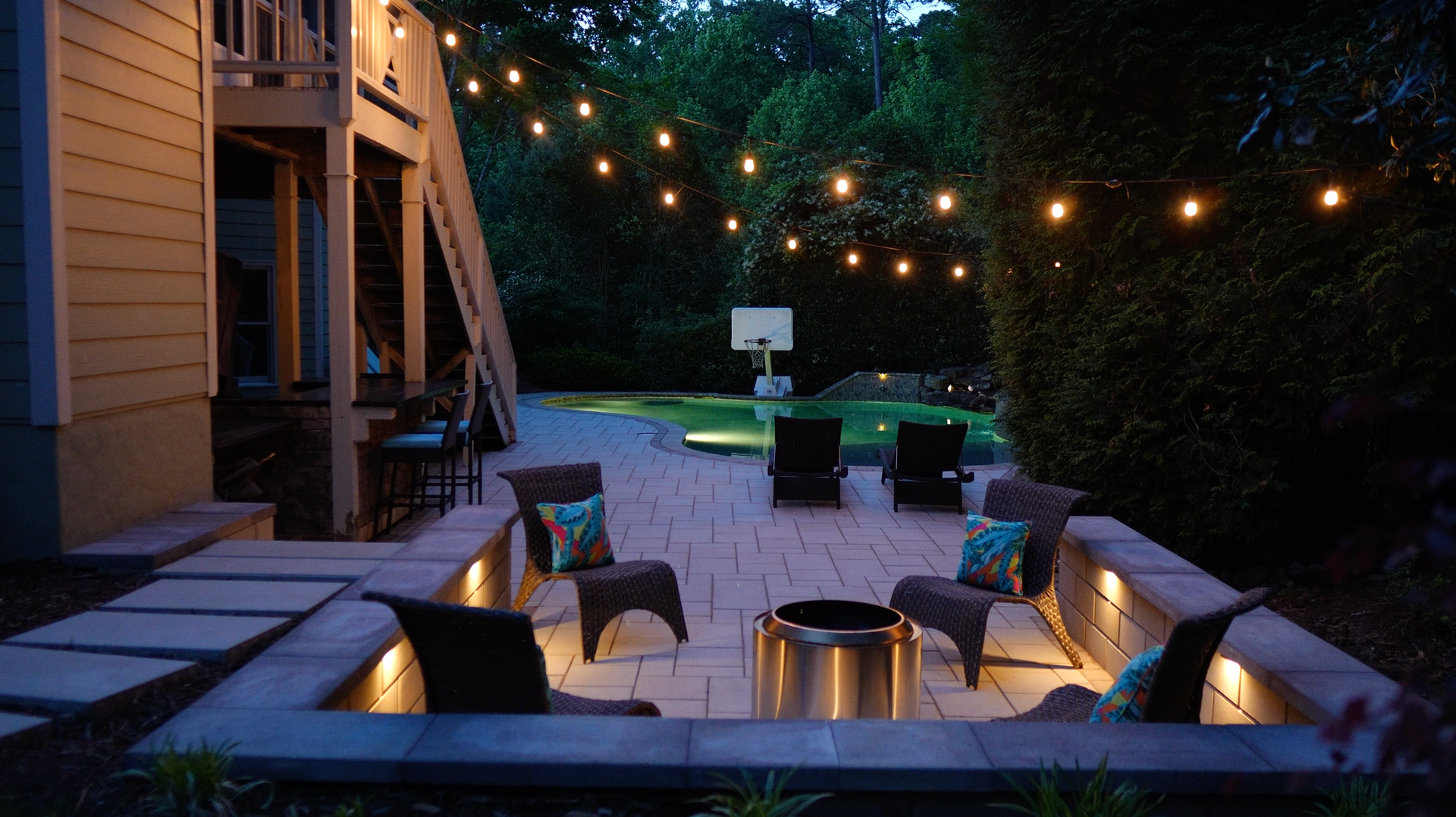 There is a fire pit in the middle of the patio.