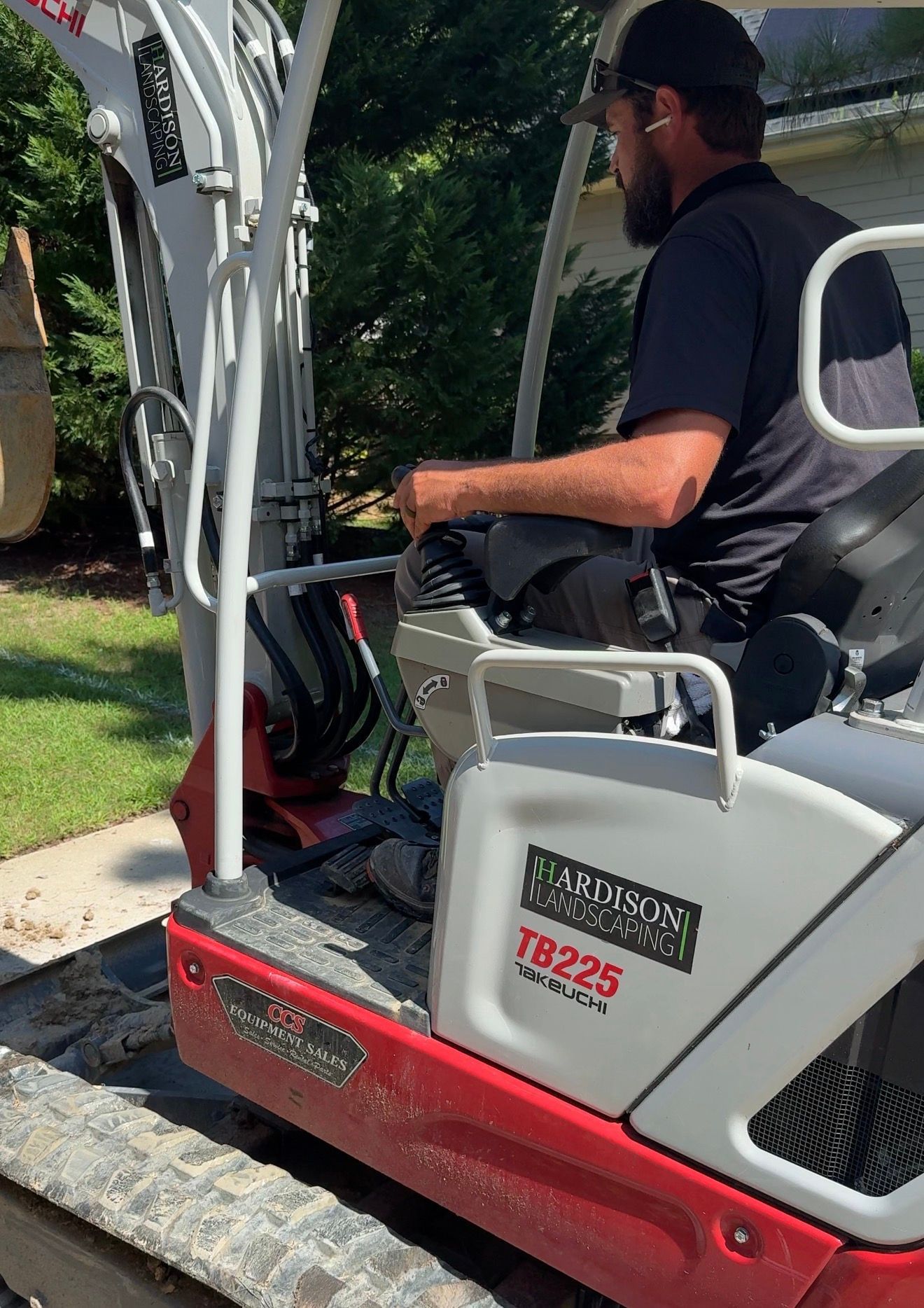 A patio with a chair and vases on it.