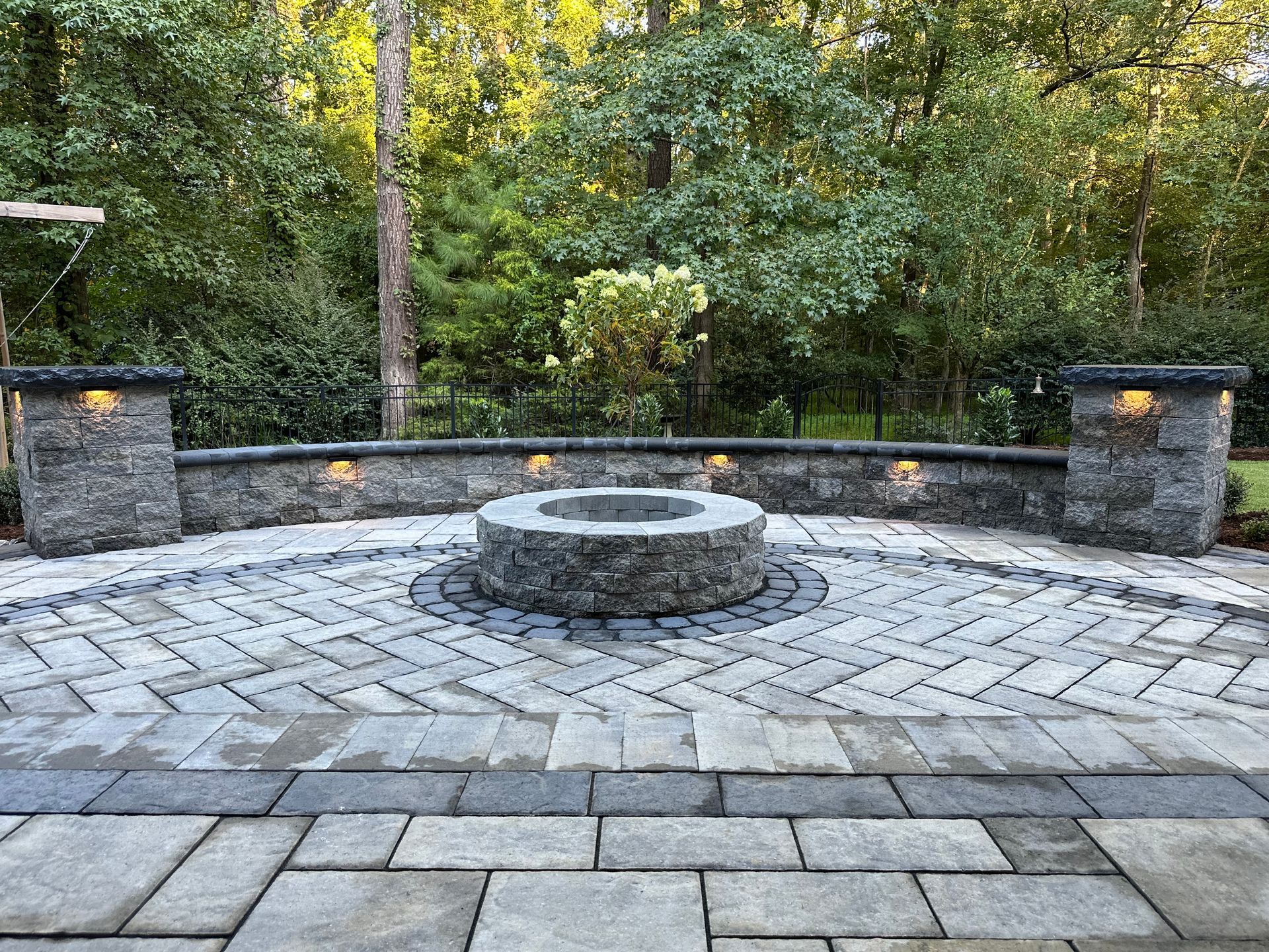 There is a fire pit in the middle of the patio.