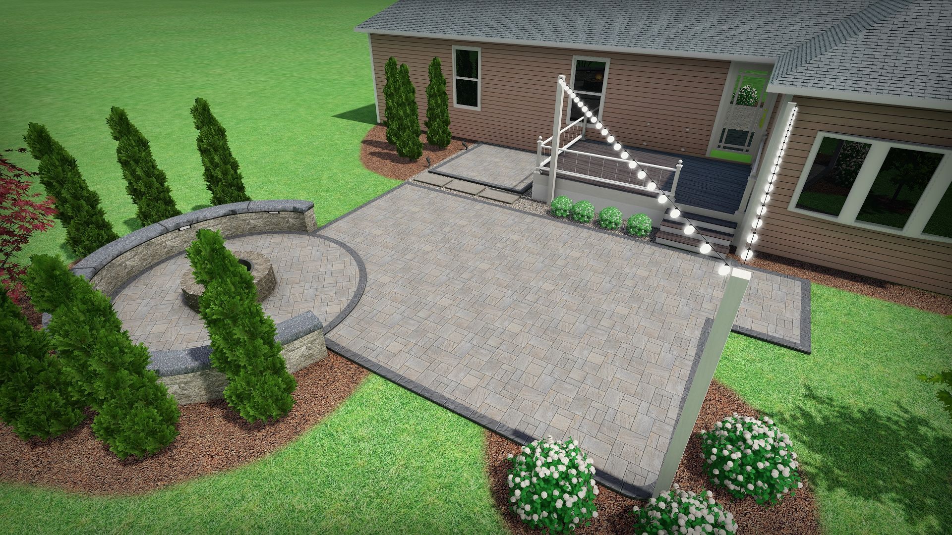 An aerial view of a house with a patio and trees in front of it.